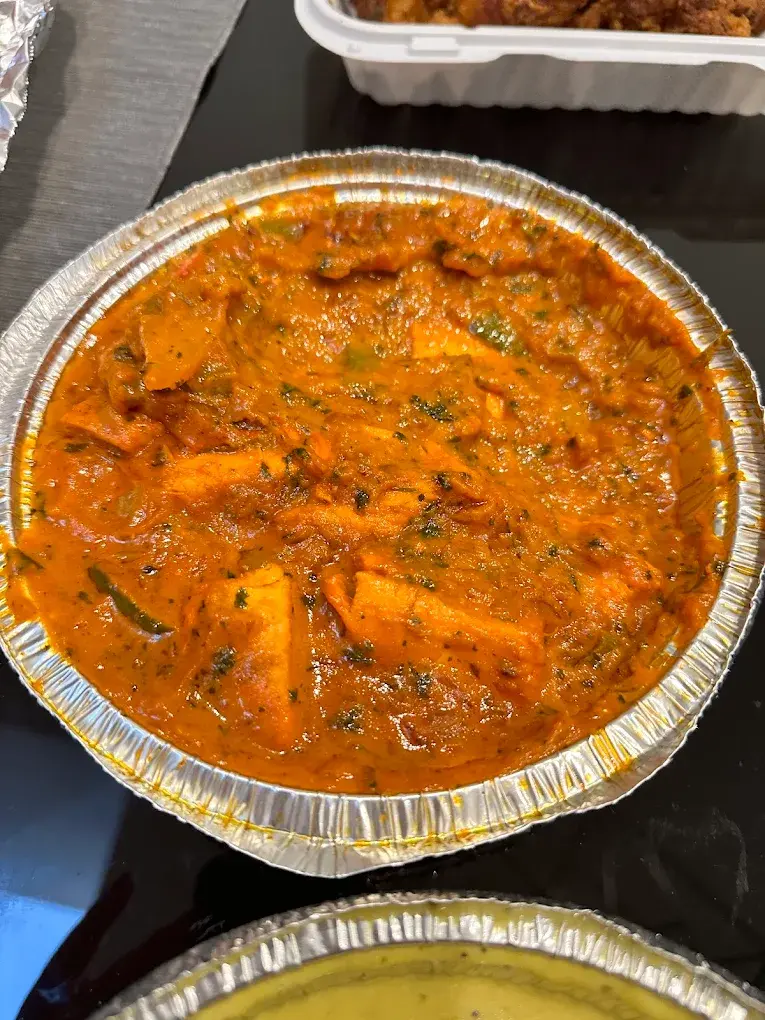 Traditional Gulab Jamun dessert at Namak Mirchi Calgary, AB